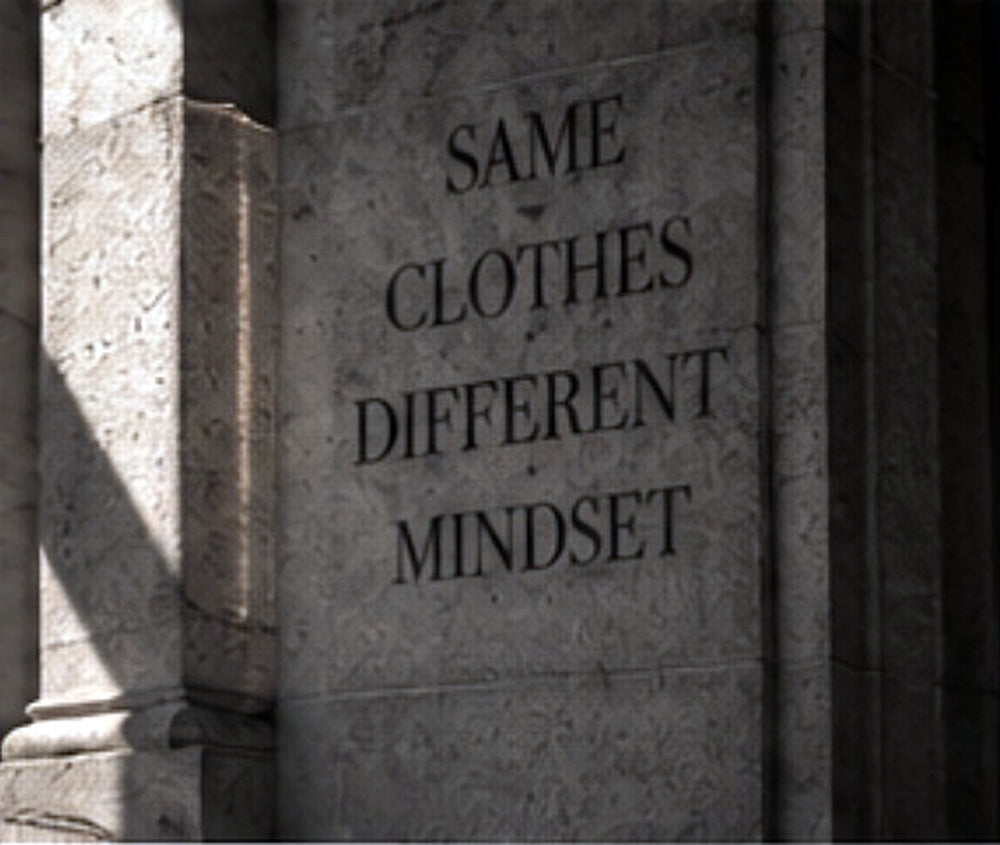 BARE BONES design philosophy carved stone wall reading Same Clothes Different Mindset