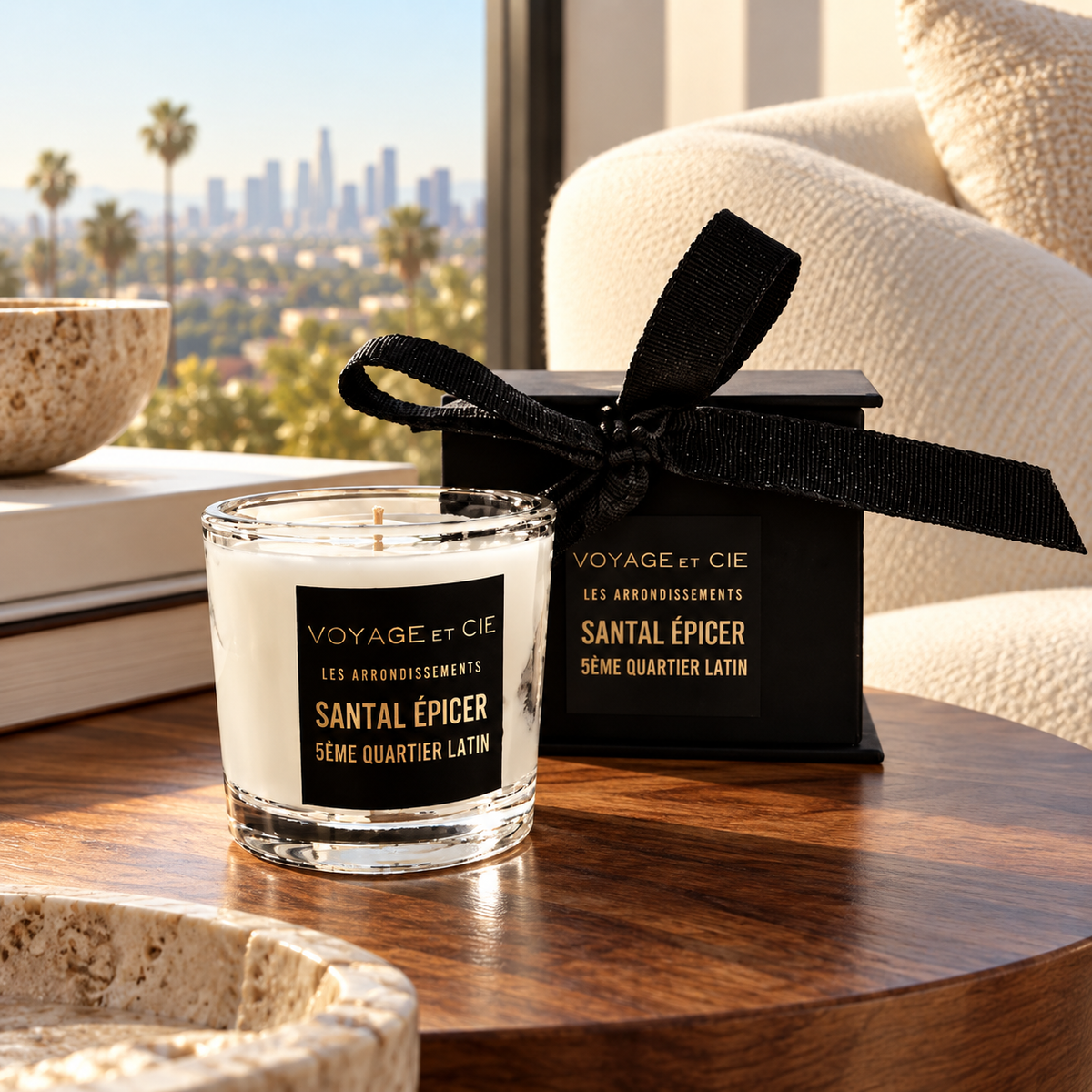 Voyage et Cie Santal Épicé votive candle styled on a walnut table in a Los Angeles living room